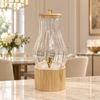 Teardrop ribbed glass beverage dispenser with wooden stand