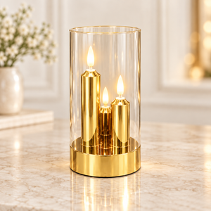 Three-in-one gold LED candle display in a clear cylinder