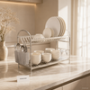 Two-tier aluminum dish drying rack with plates bowls and cutlery