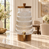 Wavy ribbed glass beverage dispenser with wooden stand and gold tap