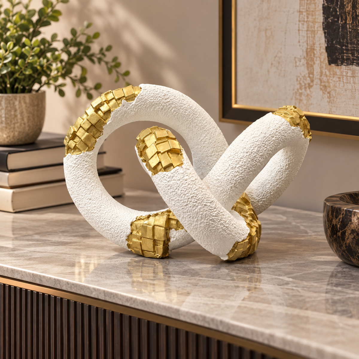 White and gold interlocking loop abstract sculpture