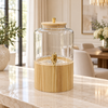 Wide glass beverage dispenser with tall light wooden stand