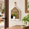 House-shaped wooden wall key holder with three hooks