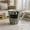 Zebra Elegance Ceramic Mug – Luxury Black & White Coffee Cup with Gold Rim